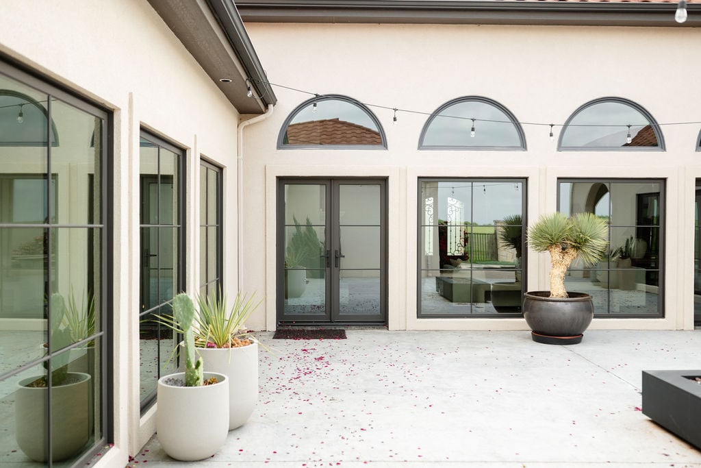 Wichita Falls Home Exterior with Large Windows and Roudned Transom Windows