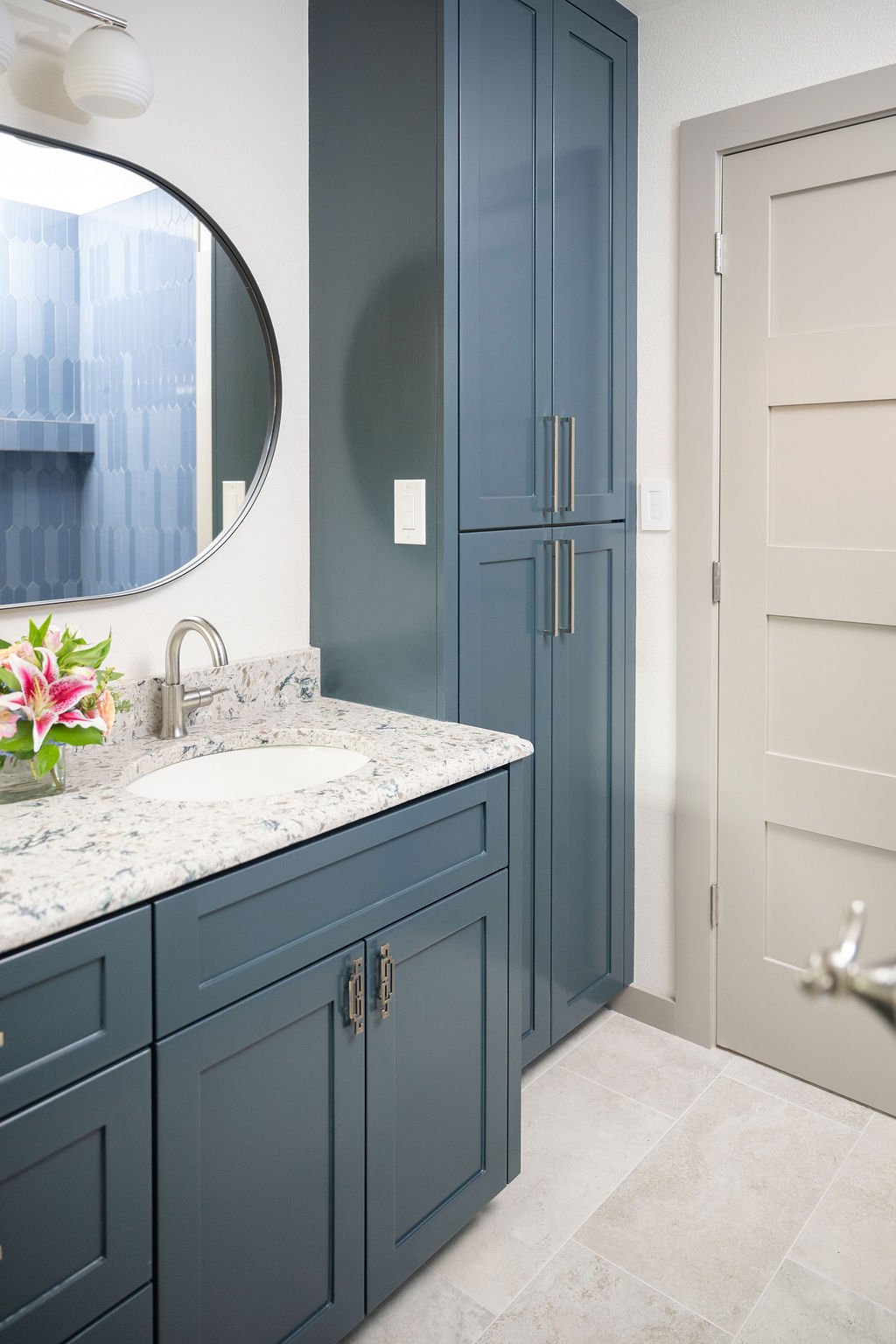 Updated Bathroom with blue cabinets
