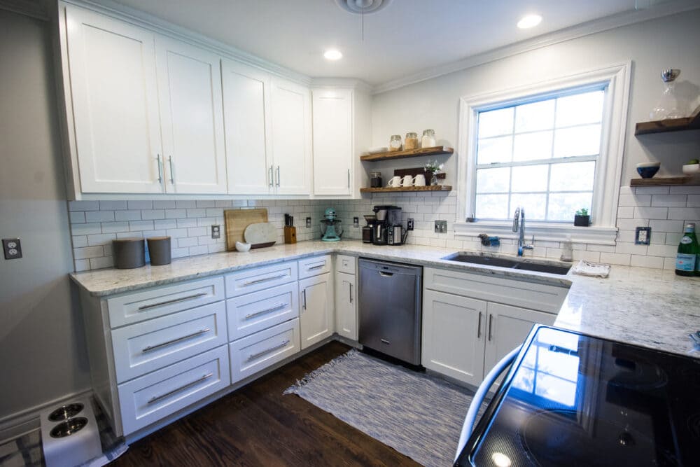 Modern Kitchen with White Cabinets and Marble Countertop