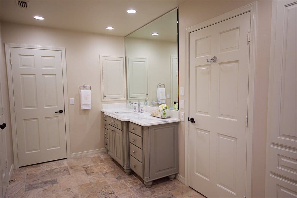 White Bathroom with Large Mirror and Grey Under-sink Storage