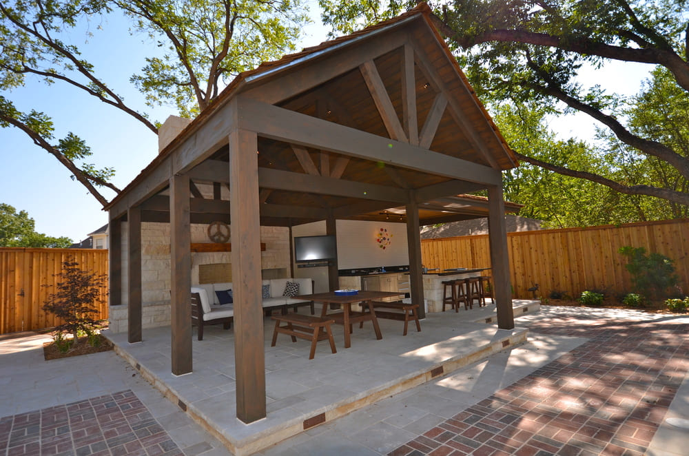 Outdoor Living Area with Television and Benches for Seating
