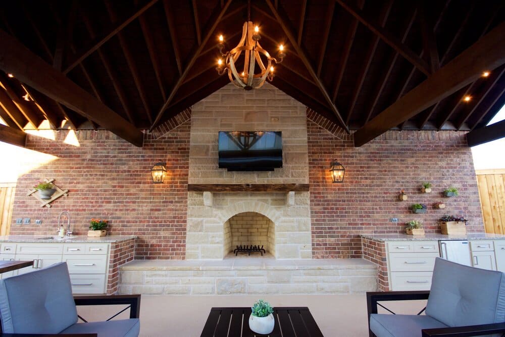 Fireplace with TV Mounted and Chandeler on Ceiling