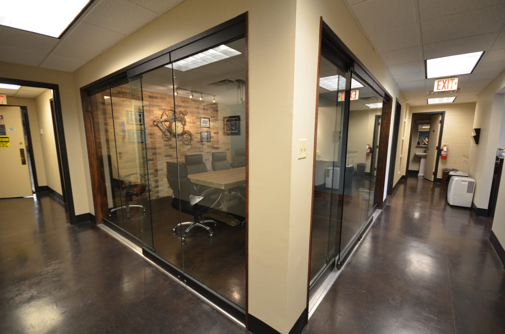 Corner Office with Glass Showing Inside Brick Meeting Room