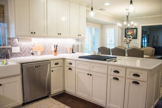 Rural Kitchen with Stainless Steel Washing Machine and White Cabinets Under White Countertop