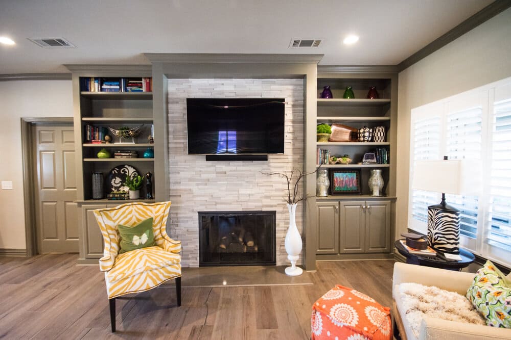Living Area with White Fireplace and Mounted TV