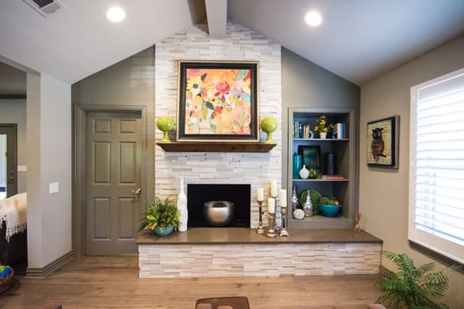 Living Area with Grey Brick Wall and Fireplace with Steel Pot Inside