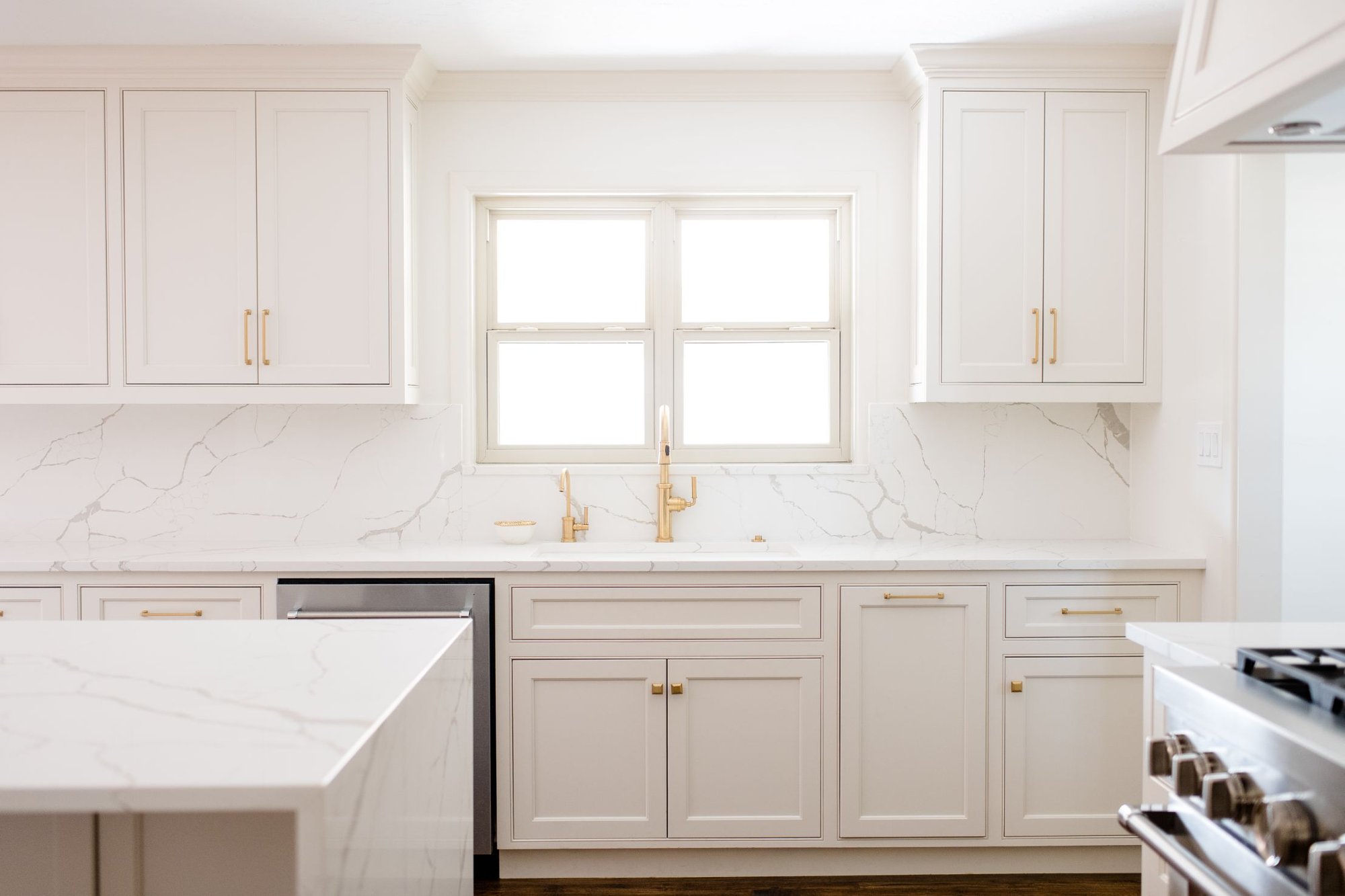 White Kitchen with White Countertops and White Cabinets