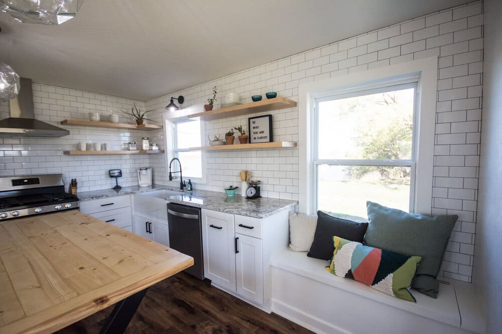 Rustic Kitchen with Light Wood Table and Subway Tile Walls