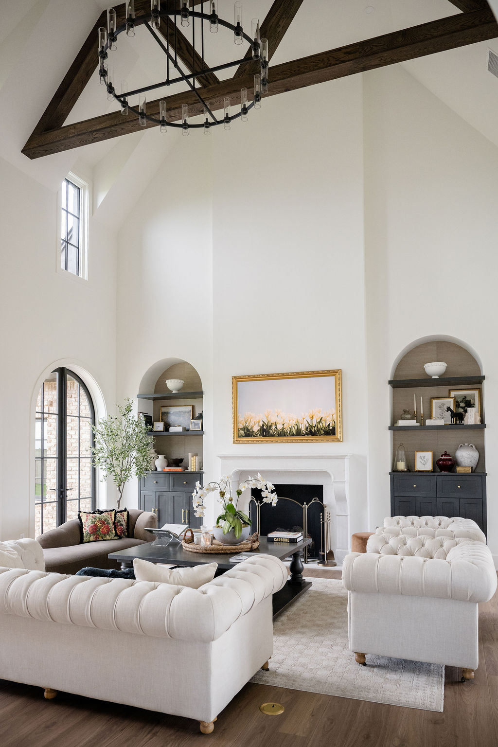 Living Room with Built-in Shelving and Elegant White Furniture