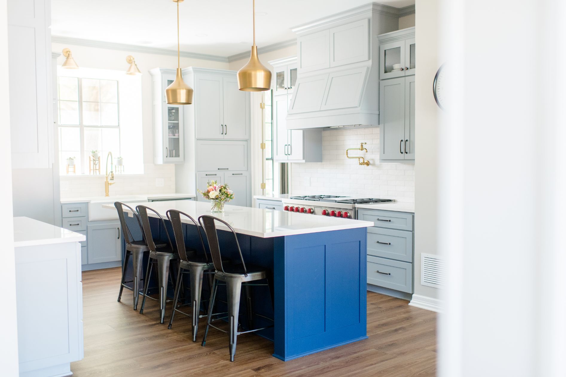 Transitional Kitchen with Blue Wood Under Glossy White Countertop