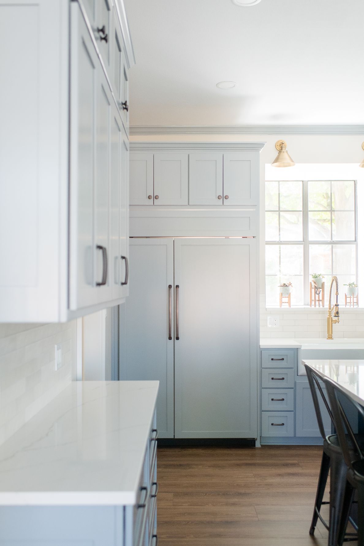 Light Blue Transitional Kitchen Featuring Glossy Countertop