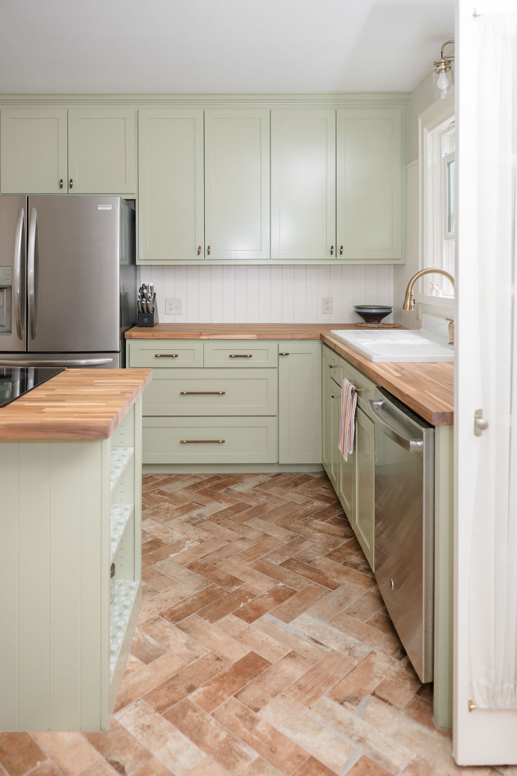 Wichita Falls Kitchen Remodel with Light Green Cabinetry and Stainless Steel Appliances